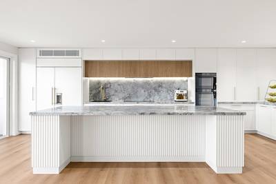 Discover a modern kitchen remodel with luxurious marble finishes. Enhance your home with Dura Group's expertise. Contact us for your renovation!