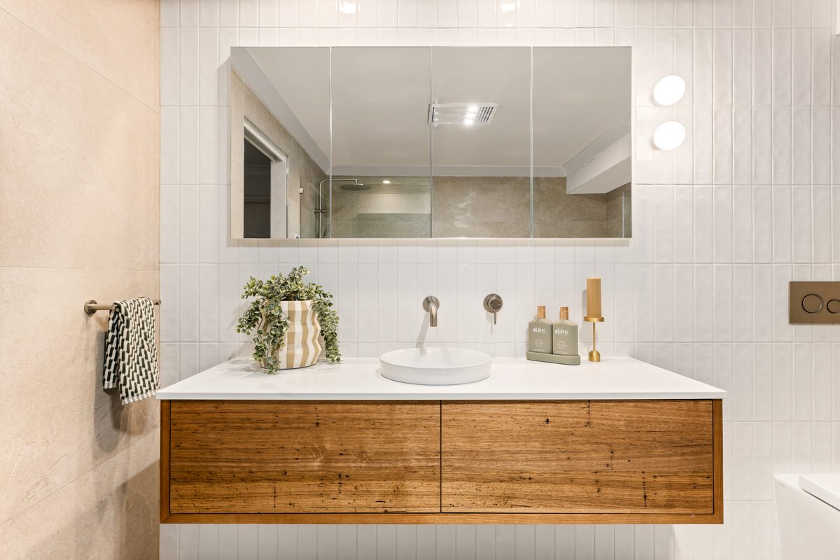 Bathroom renovation with timber vanity and vertical tiling