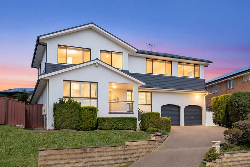 Completed two-storey Coachwood home at dusk, Alfords Point