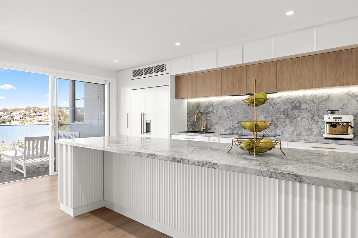 Kitchen renovation with fluted island and stone benchtop