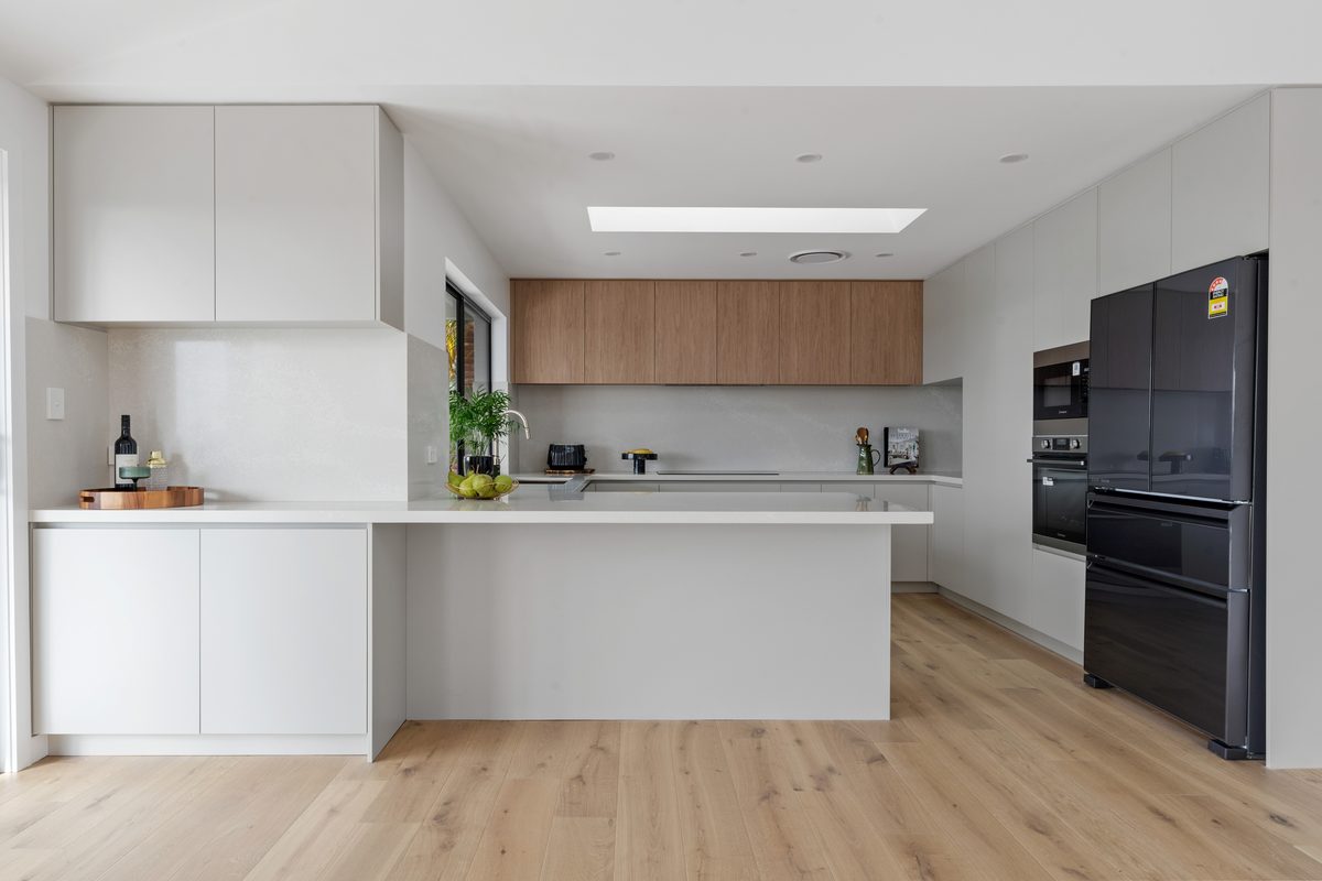 Kitchen renovation with white and timber cabinetry